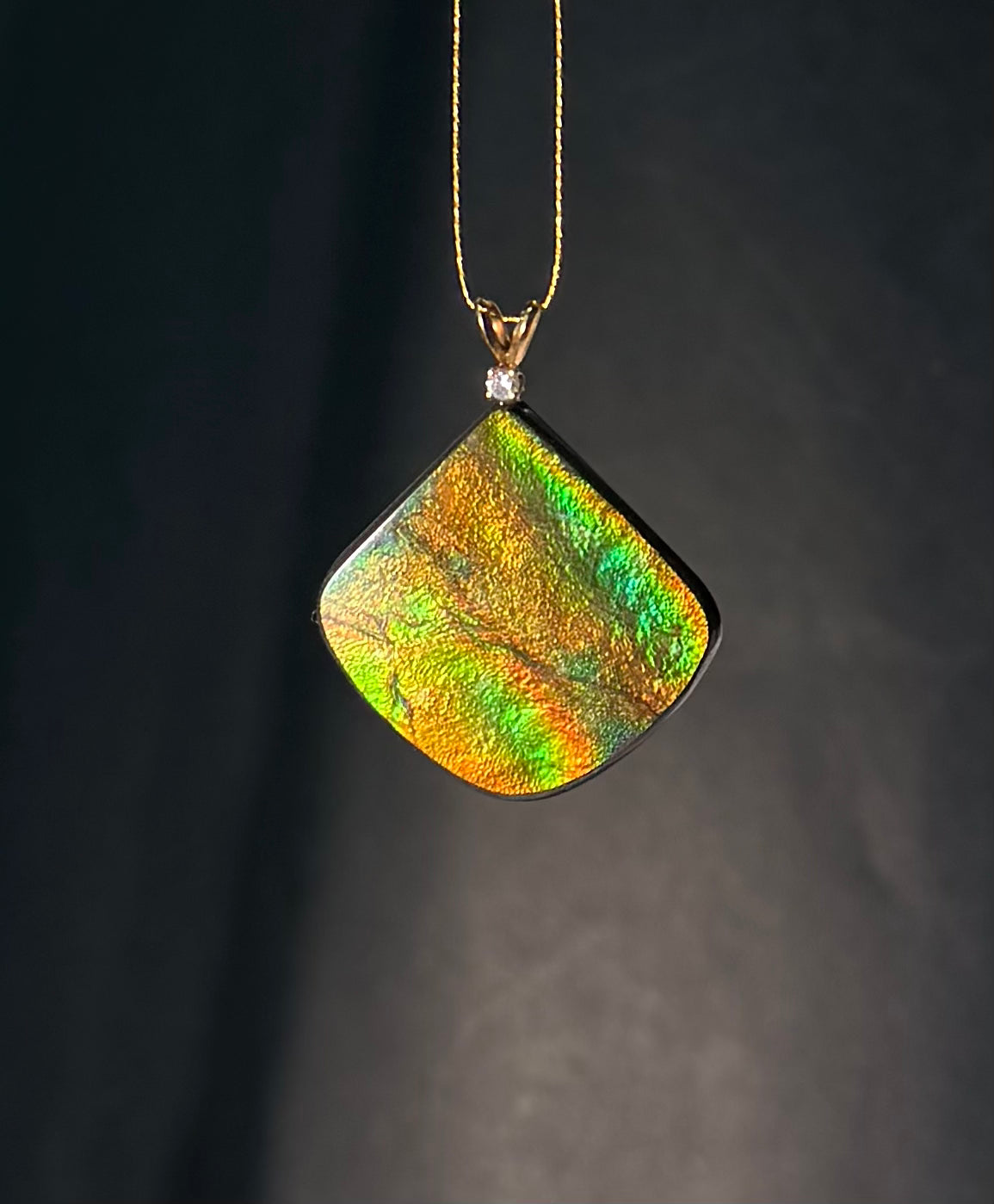Bright northern light colours from bright gold yellow-green, green, blue AAA One-piece solid Ammolite Pendant, 14K Bail with genuine diamond.  