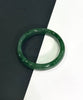 A grade Rich green jade bangle bracelet on a black and white background