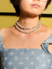 Model wearing 30 inch Japanese baroque pearl necklace layered as a double-strand choker