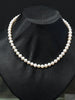Close-up of high mirror luster genuine freshwater pearls showing natural clean surface texture