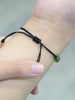 An Ammolite bracelet worn on a wrist, demonstrating its adjustable size and fit from 5.5 to 8 inches.