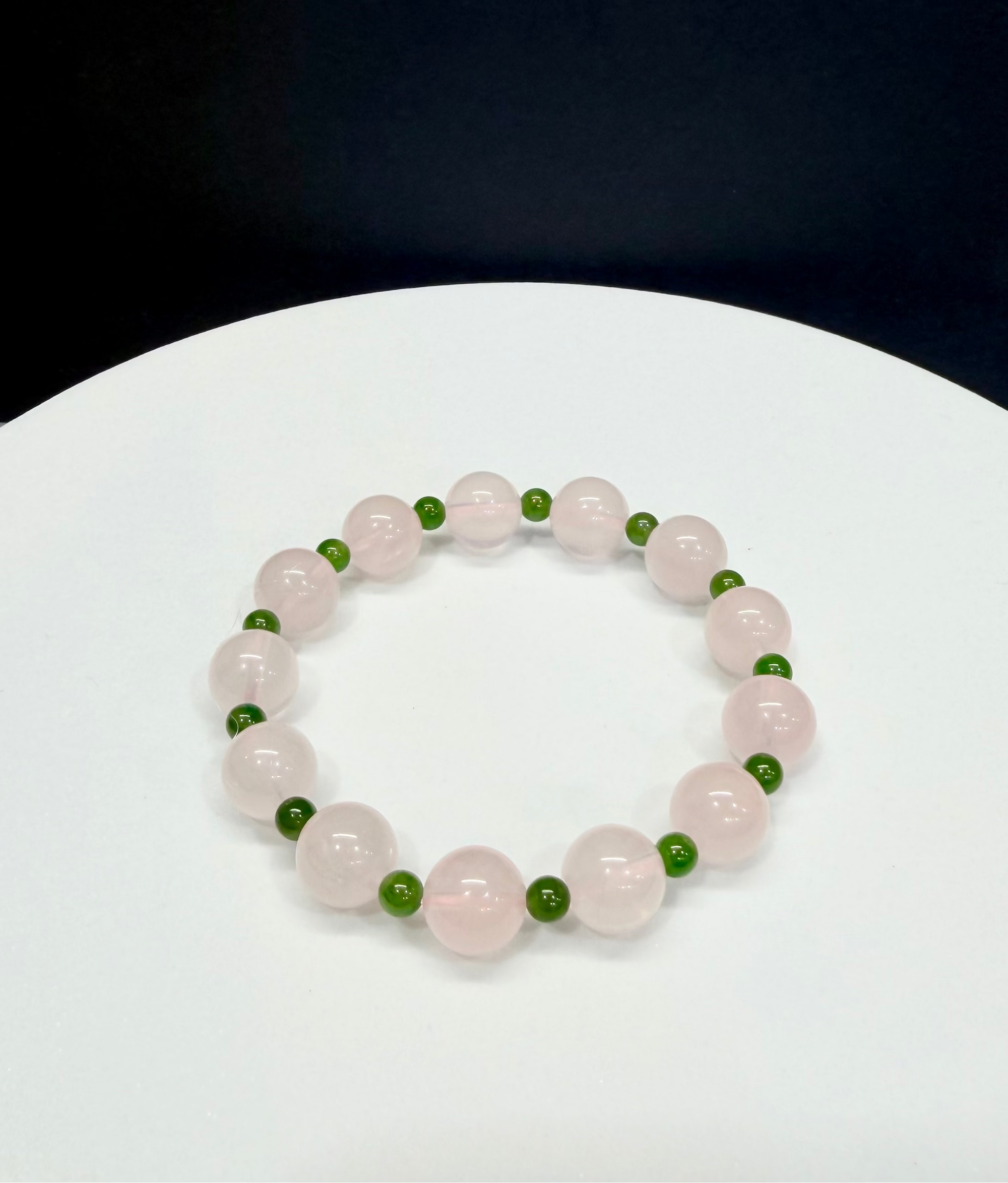 Natural Premium Rose Quartz and Nephrite Polar Jade hand-braided healing crystal bracelet, styled by Natural Gems Canada in Markham, Ontario.