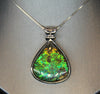 Whole piece of Canadian ammolite stone. Color changing from yellow, green, bluish green to blue, high flash coloration.