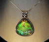 Whole piece of Canadian ammolite stone. Color changing from yellow, green, bluish green to blue, high flash coloration.